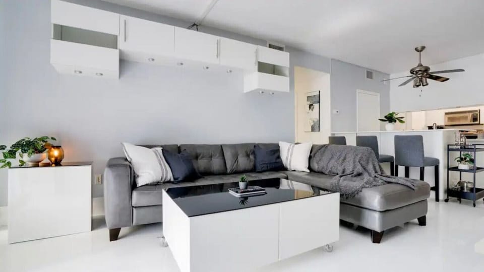 Bright and spacious living room equipped with full size couch