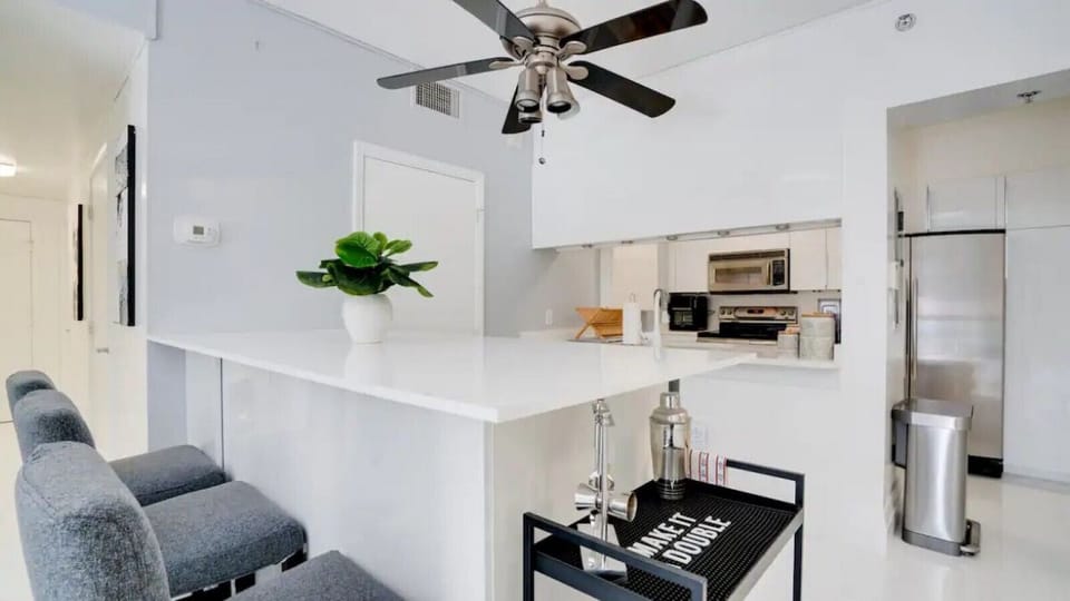 Kitchen equipped with quality appliances, cookware, and utensils