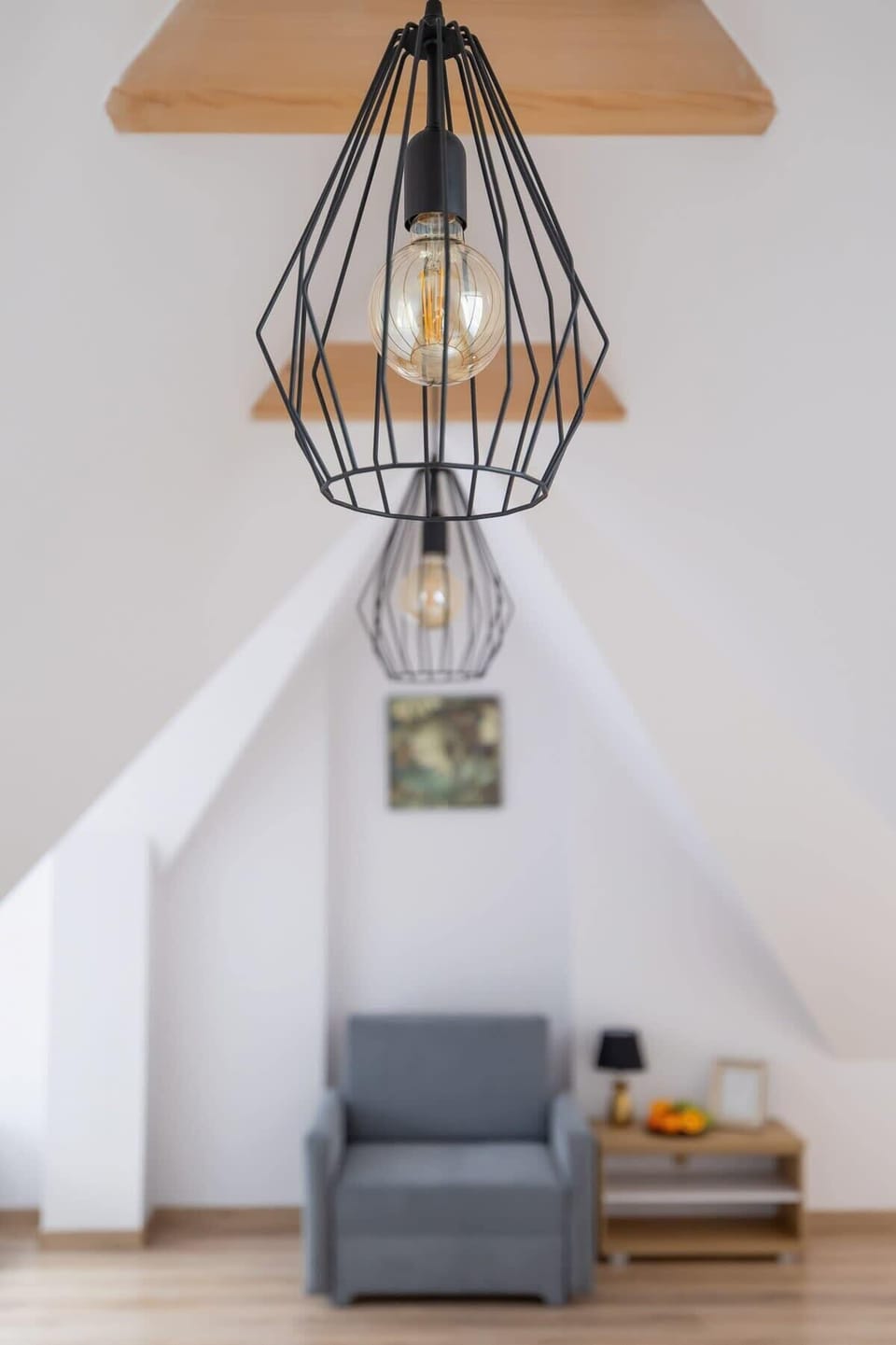 A unique ceiling lamp adding character and warmth to the bedroom space.

