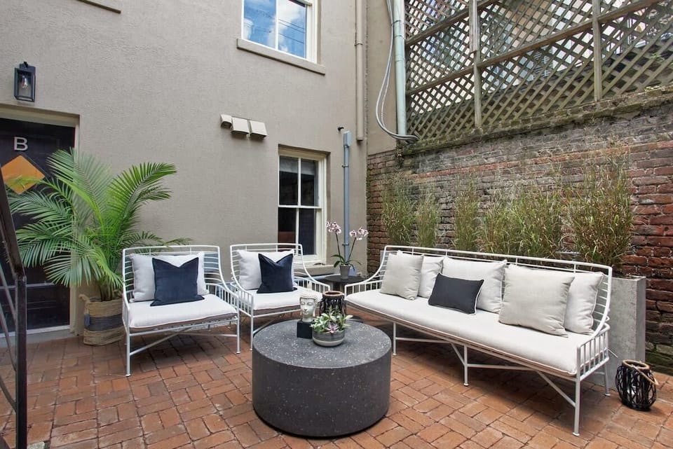 Welcome to our Charming, Elegant Historic Home! Courtyard | Shared Outdoor Courtyard with Outdoor Sofa and Seating | Ground Floor