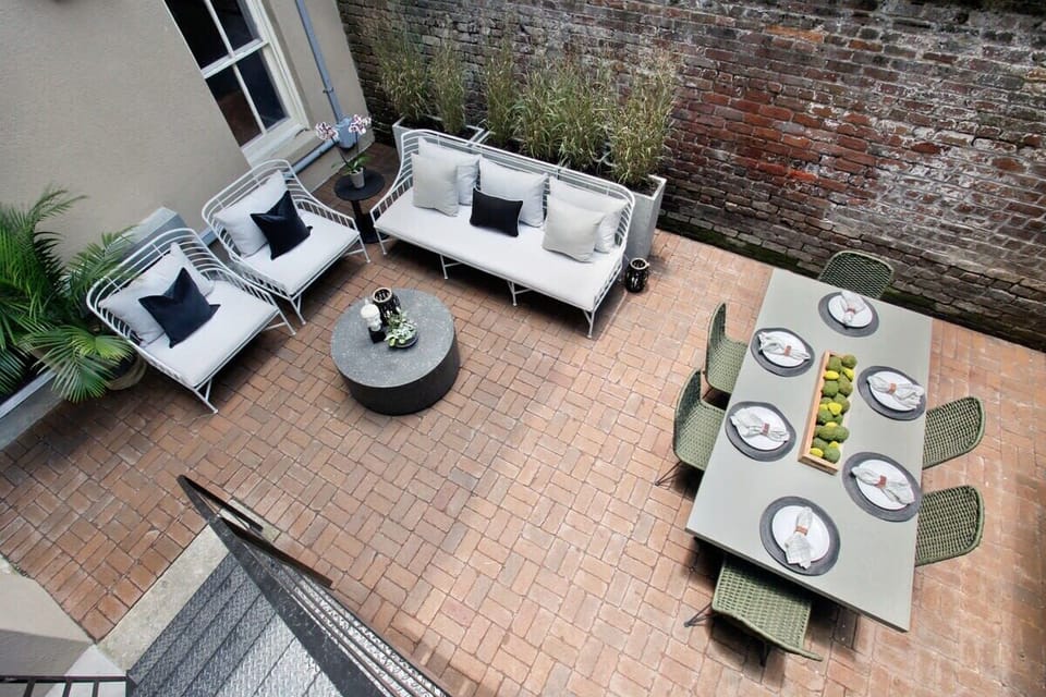 Courtyard | Shared Outdoor Courtyard Aerial View with Dining Table and Seating | Ground Floor