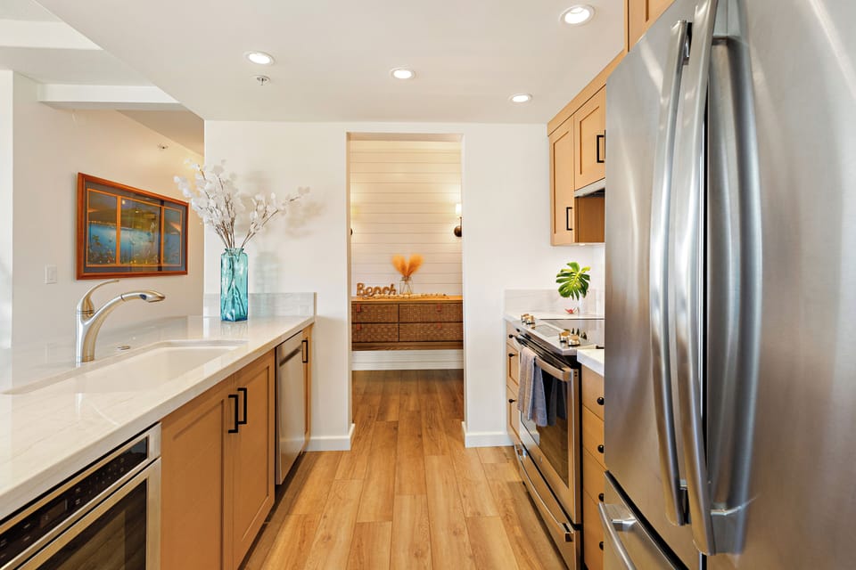This modern, fully equipped kitchen features stylish finishes, ample counter space, and everything needed to prepare meals with ease during your island getaway.