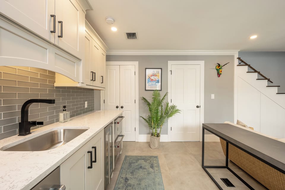 Sink, coffee maker, 4 refrigerator/freezer drawers, and a wine cooler