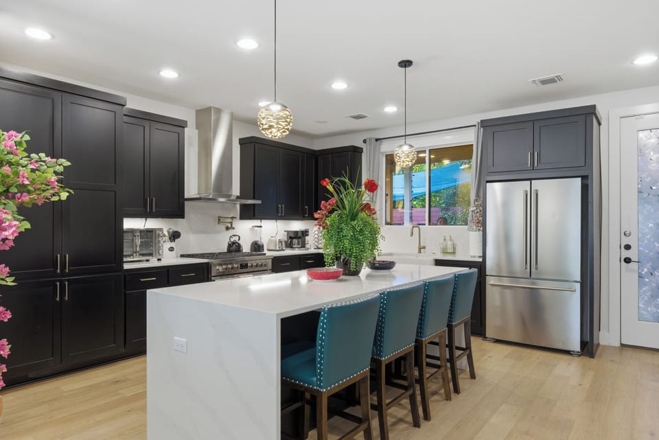 The chef gourmet kitchen w/fully stocked cooking utensils &essential condiments.