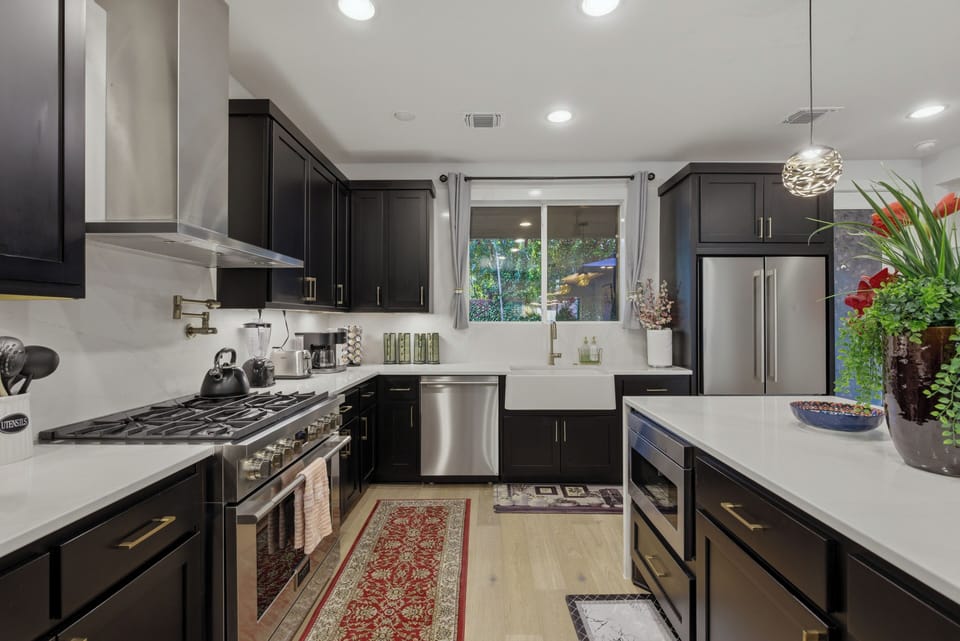 The chef gourmet kitchen w/fully stocked cooking utensils &essential condiments.