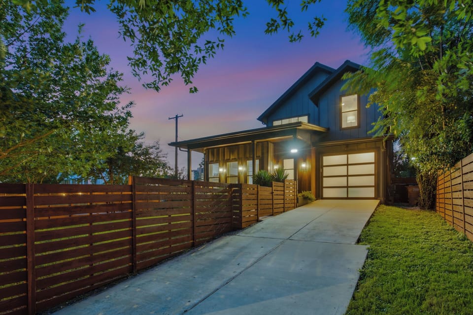 The exterior view of the home. It’s fully fenced&gated at the prime DT location.
