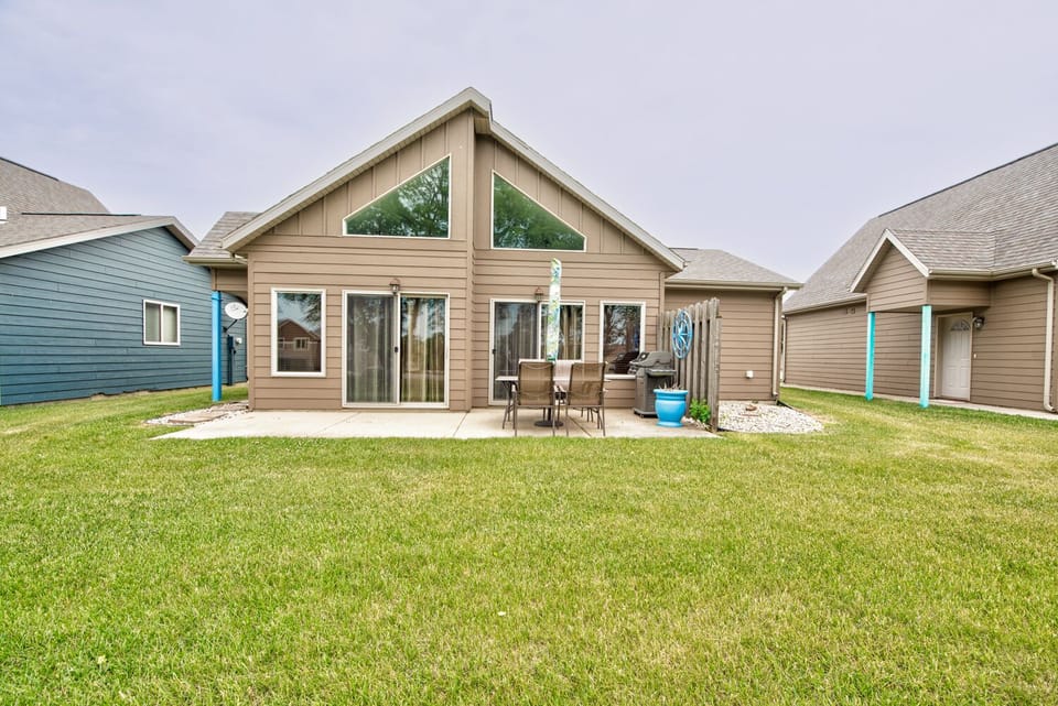 Patio with grill, outdoor table and yard
