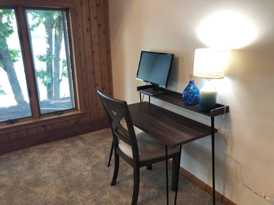 Small desk/office area in master bedroom with view of the lake.