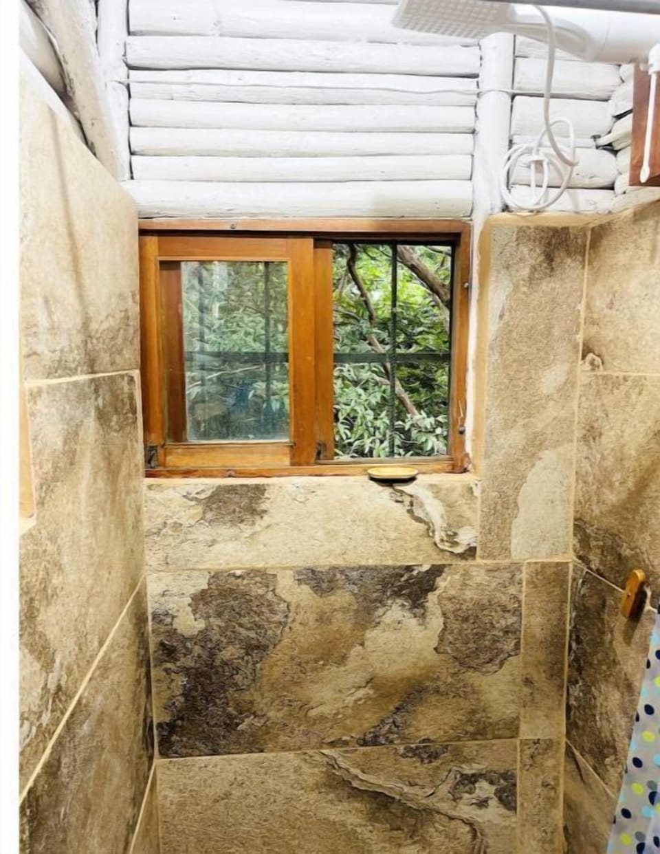full bathroom in second floor with view to the forest