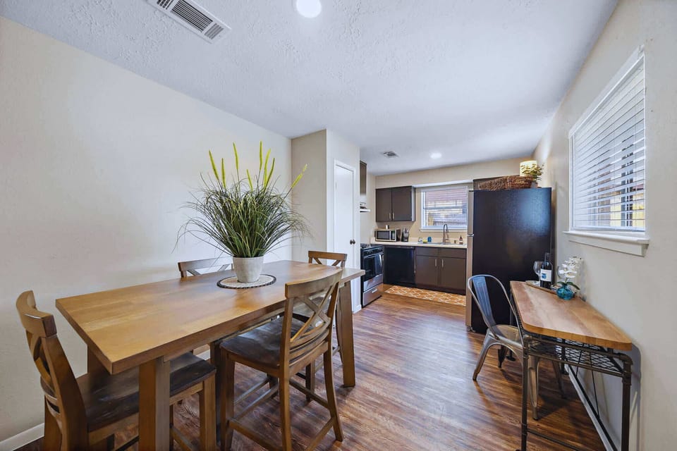 Dining Area: Enjoy meals at this stylish table with a view and modern kitchen amenities!