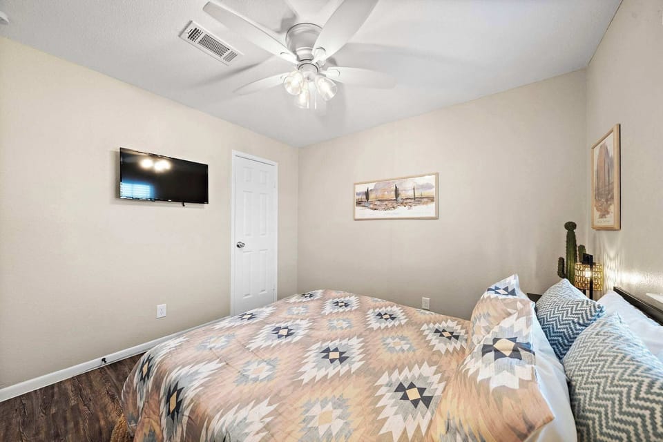 Bedroom: Relax in style with vibrant decor, modern amenities, and restful vibes for all.