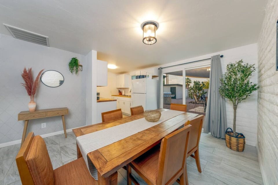 Dining area with table for six and access to back patio