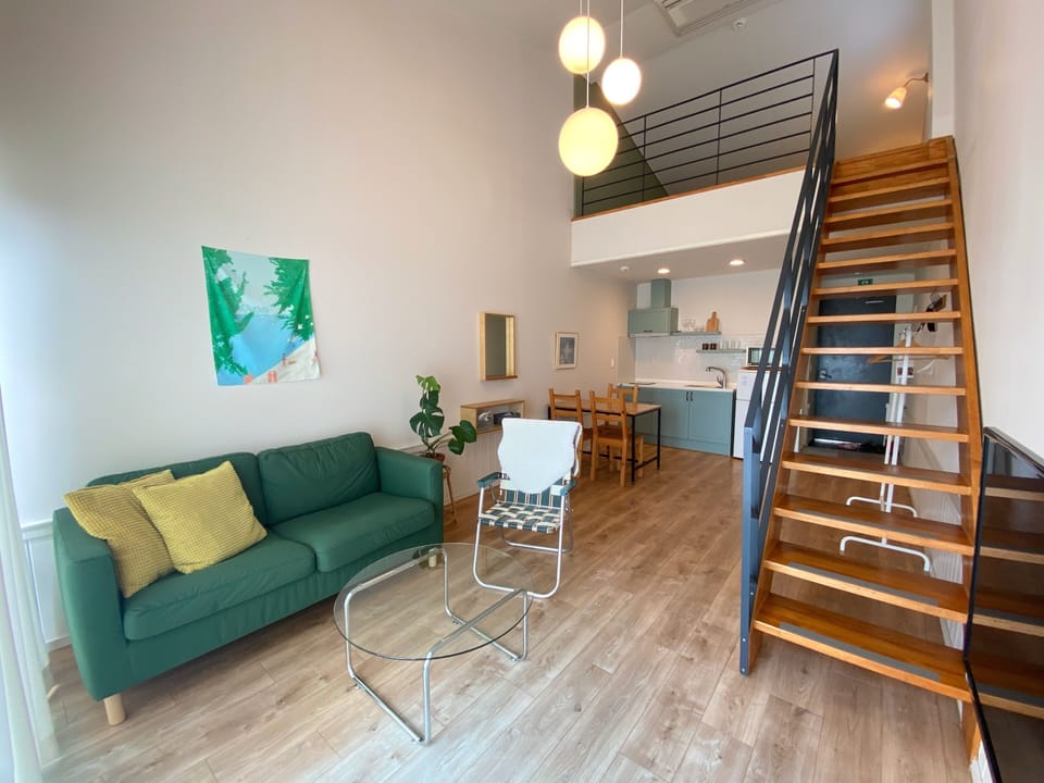 Duplex | Living area | 42-inch flat-screen TV with cable channels, TV, pay movies