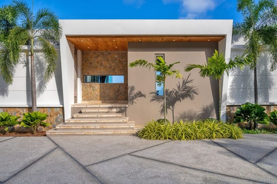 `The inviting entrance of Villa Aruna sets the tone for a luxurious stay.`