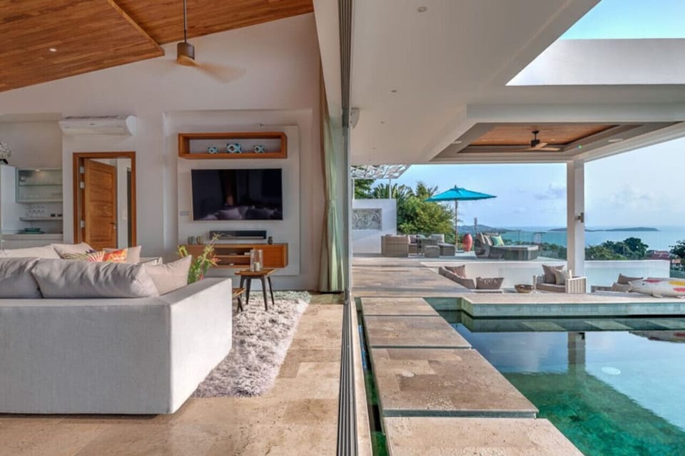 `Seamlessly transition from the open living area directly into the pool for a refreshing dip.`
