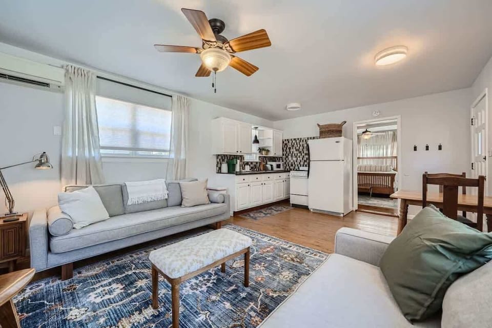 Kick back in a cozy living room with plenty of seating for everyone.