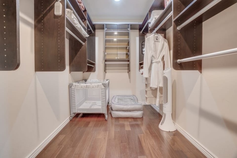 Bedroom 1 Walk-in Closet with Dog Beds and Pack 'n Play.