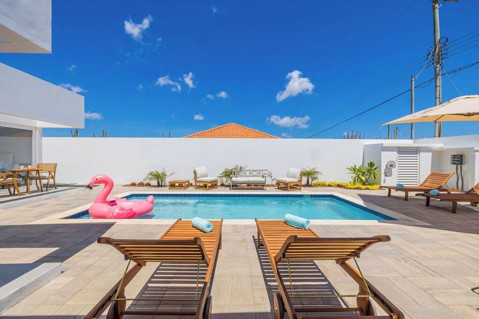 Serenity by the poolside - bask in the sun's embrace on our inviting sun loungers.