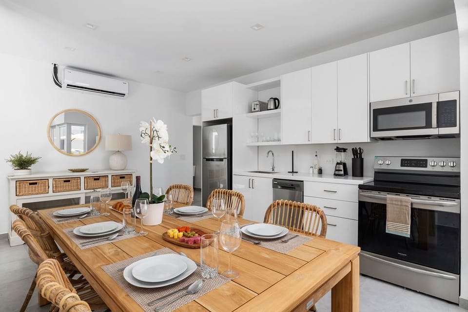Elegant dining space set for unforgettable moments - experience gourmet delights in our rental property.