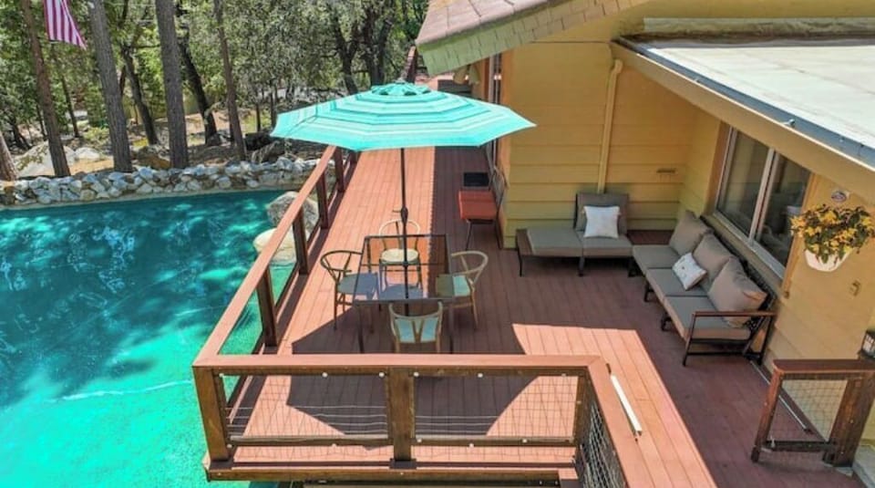Peaceful deck with seating and beautiful forest views.