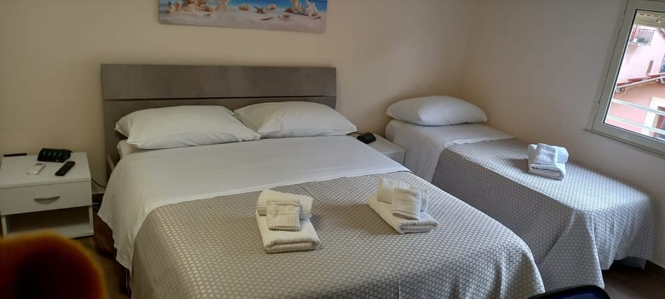 Standard Triple Room | Minibar, desk, laptop workspace, soundproofing