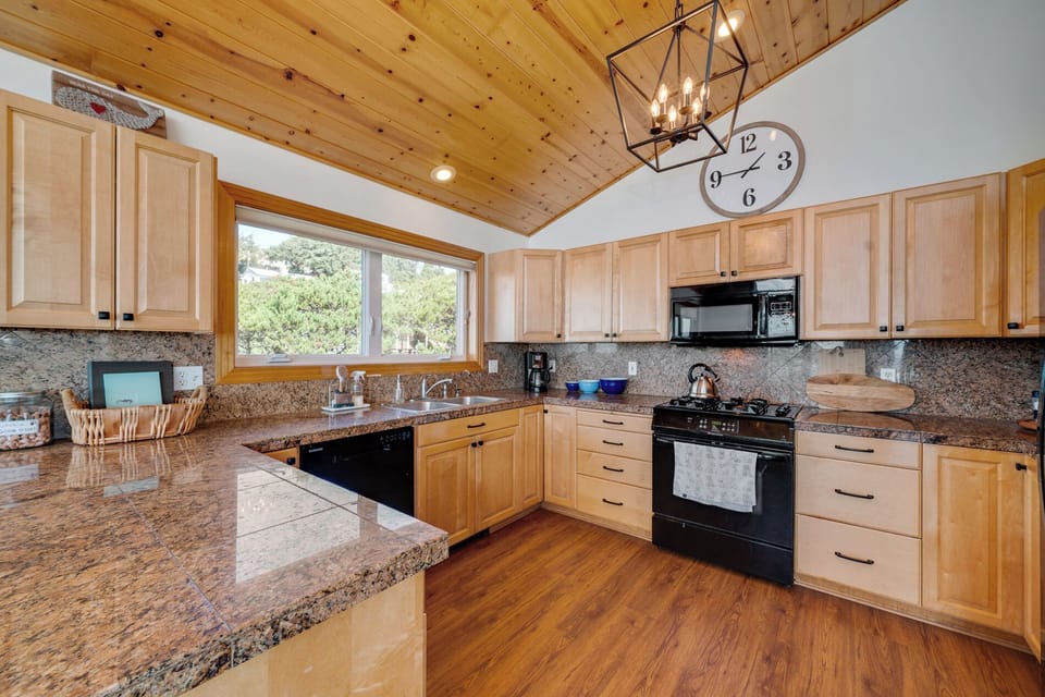 Well stocked chef's kitchen with plenty of counter space.