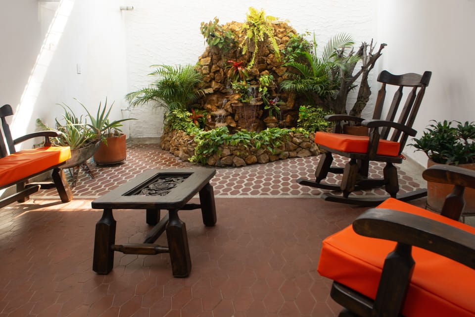 ZEN-LIKE PATIO AREA WITH PEACEFUL WATERFALL, HD/SMART TV, AND BLUETOOTH SPEAKERS