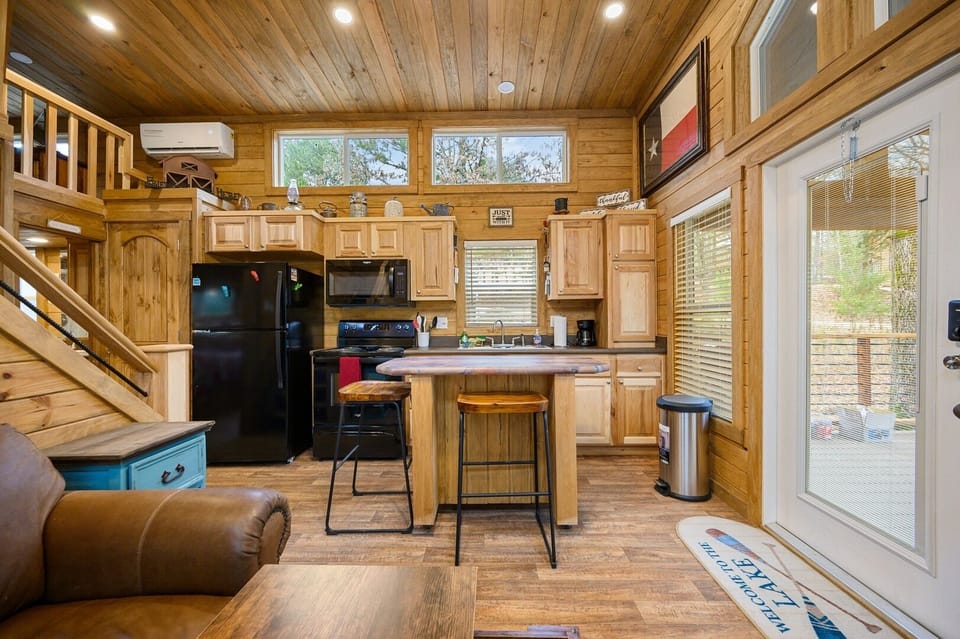 The kitchen comes complete with a refrigerator, oven/stove, microwave, and a coffee maker.  It all=so has a small island for more workspace.