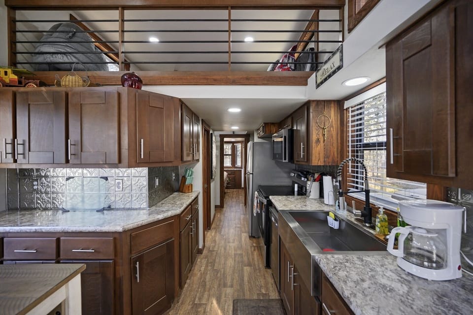 Lots of cabinet space on both sides of this galley style kitchen gives you plenty of room for storing your food and keeping the counters clutter-free during your stay.
