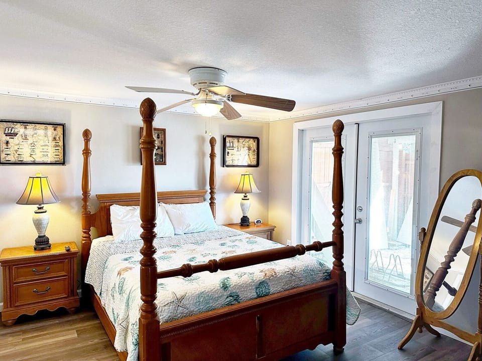 Master Bedroom Queen Sized bed in room Bathroom and TV.
