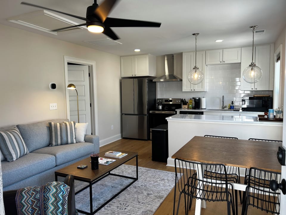 Living area with queen sofa bed, 4 person dining set, full kitchen