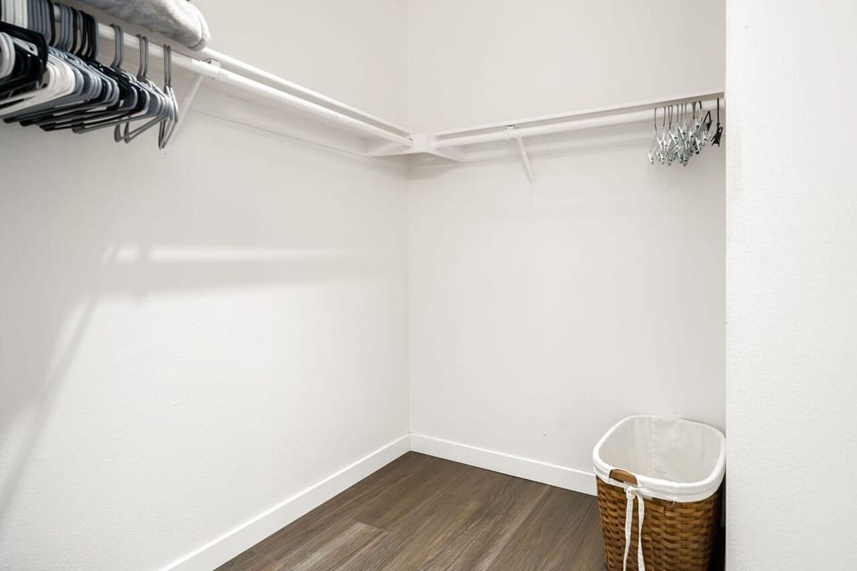 Primary closet through primary bathroom on right next to the shower!