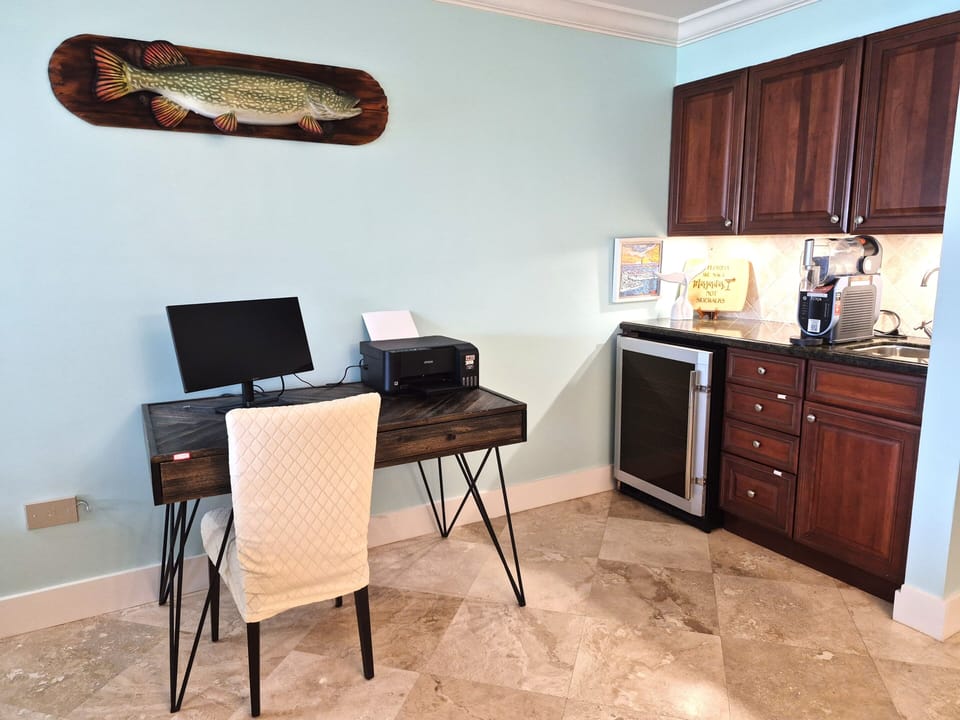Work from home! - WFH station in the living room with views of the ocean! Printer, Desktop monitor and docking station. Within reaching distance of the slushy machine ;]