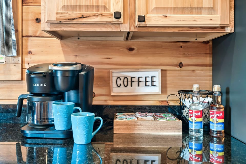 Coffee bar complete with k-cups, sugar and creamer. 
