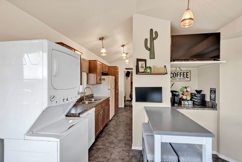 Enjoy a comfy dining area, smart TV, coffee bar, monitor, and washer/dryer.