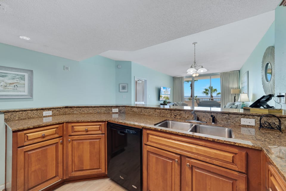 Clean lines and modern finishes define this well-appointed kitchen, offering a sleek and stylish cooking environment.