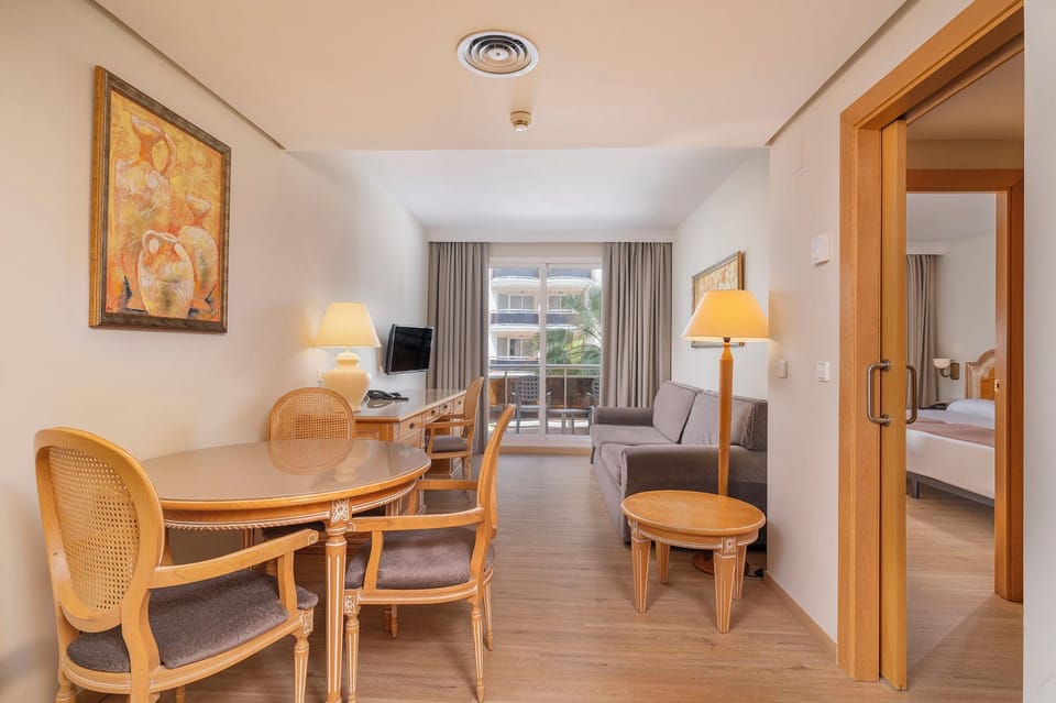 Suite, Terrace, Partial Sea View | Minibar, in-room safe, desk, blackout drapes