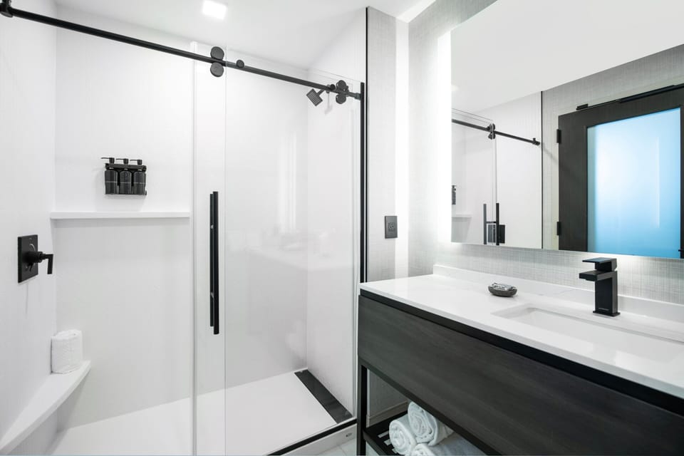 Designer toiletries, hair dryer, towels, soap