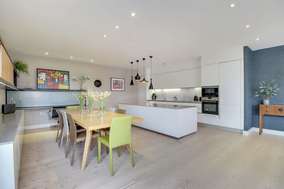 Kitchen fitted with Smeg coffee maker, kettle and toaster; All-Clad cookware