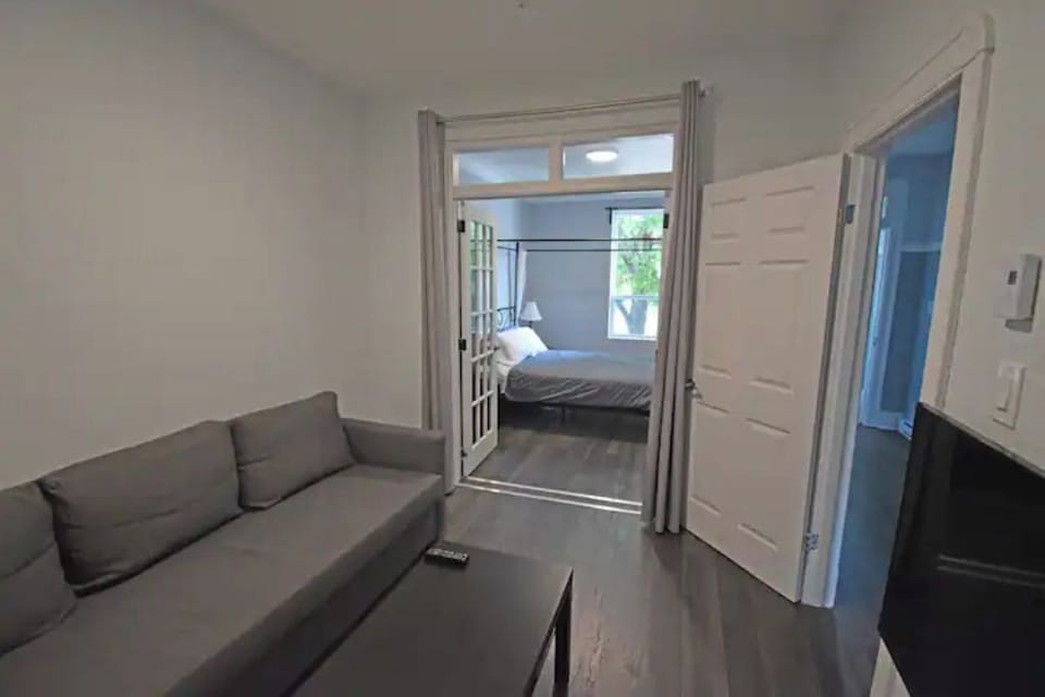 Salon - Living room with privacy french doors to bedroom #1