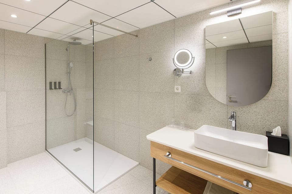 Shower, eco-friendly toiletries, hair dryer, bathrobes