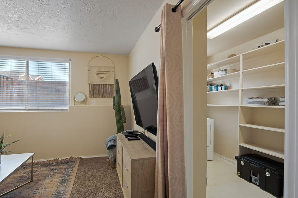 Television and entrance to laundry room