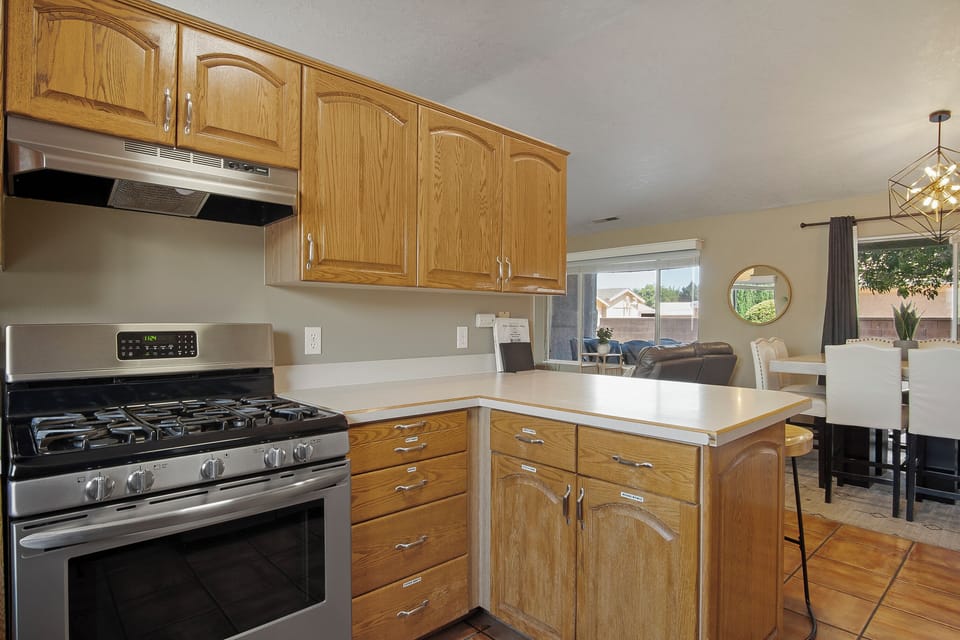 Kitchen has a gas range and oven
