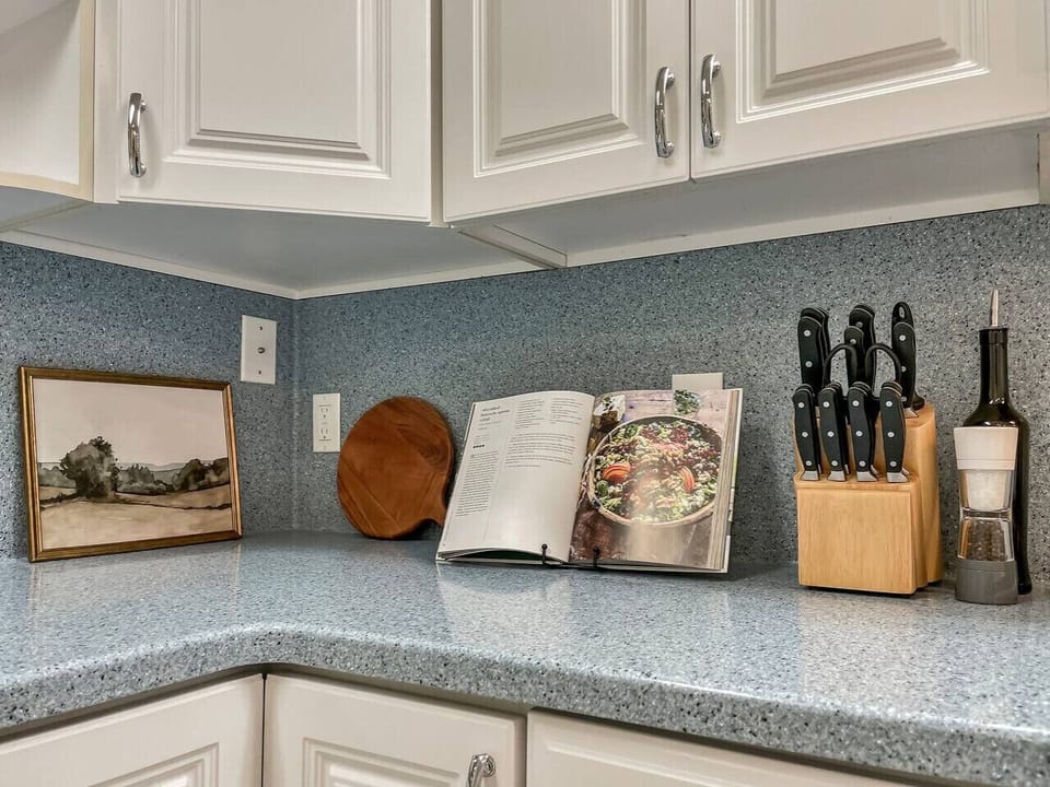 Tastefully decorated kitchen - try a recipe in the displayed cookbook!