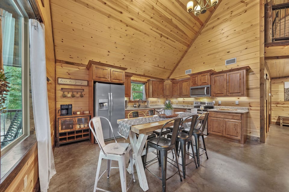 The spacious open plan kitchen lets you prepare meals while engaged in friendly conversation with your group.