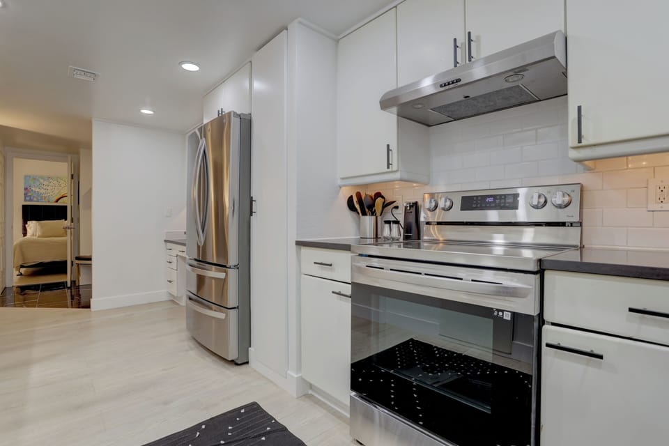 Kitchen entrance and queen bedroom view