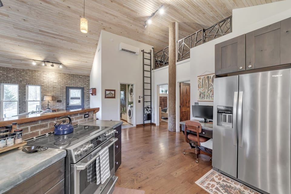 The kitchen offers modern appliances and basic necessities for preparing meals.