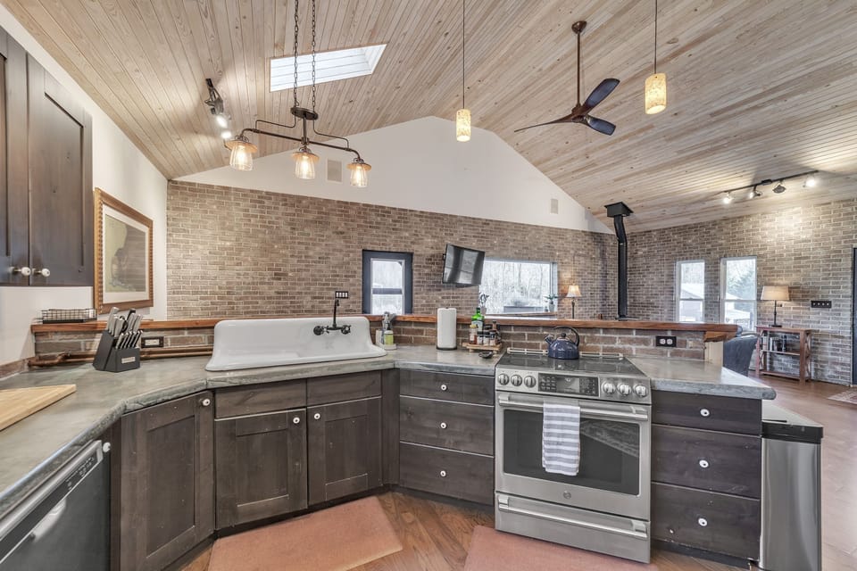 The kitchen offers modern appliances and basic necessities for preparing meals.