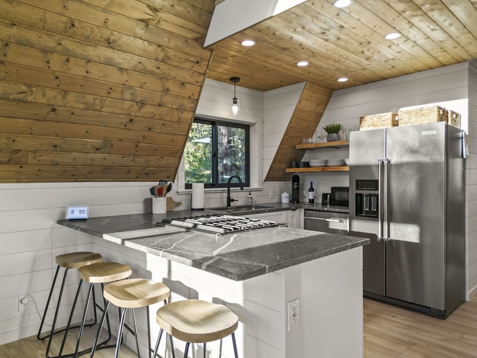 Fully stocked kitchen amenities with stainless steel Kitchenaid appliances. 