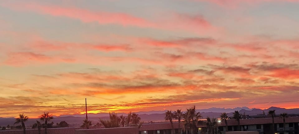 Sunset view from step out balcony towards the lake.